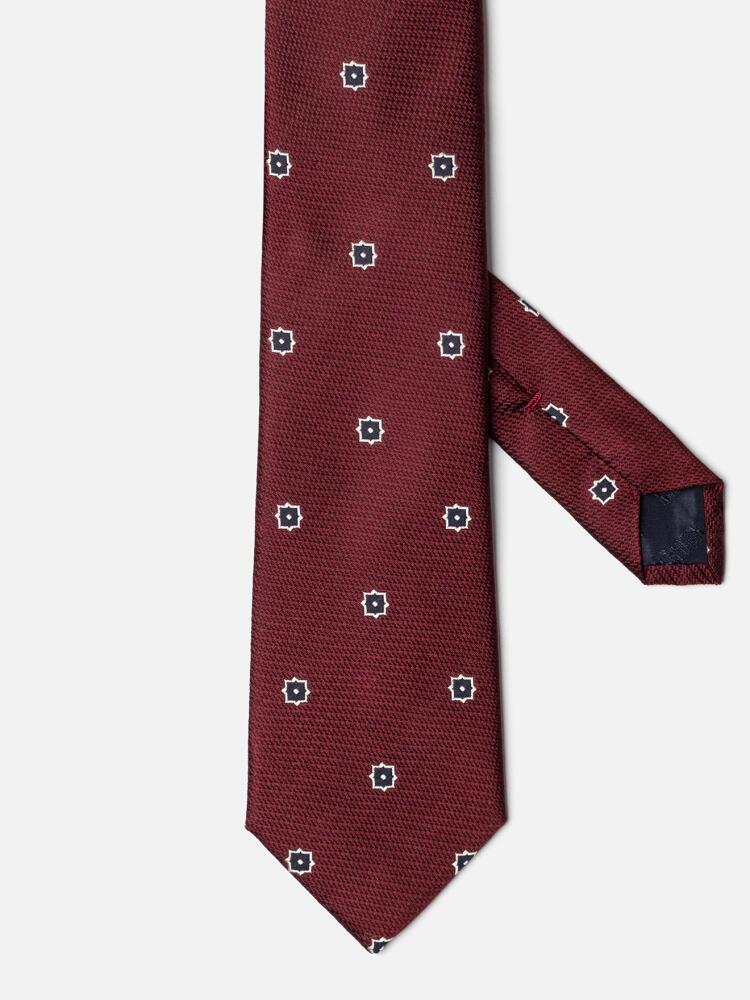 Silk tie in burgundy with navy pattern