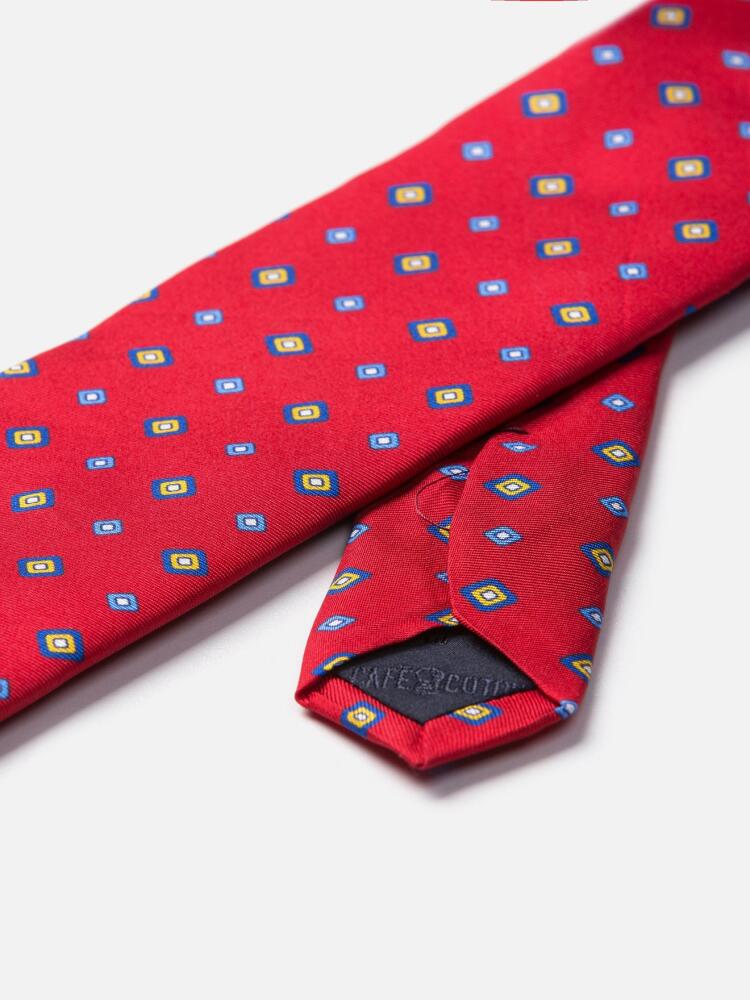 Red silk tie with printed geometric patterns