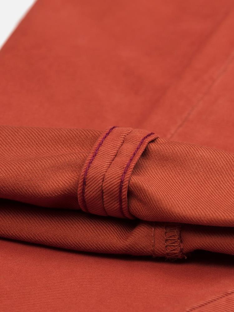 Rust coloured chino trousers